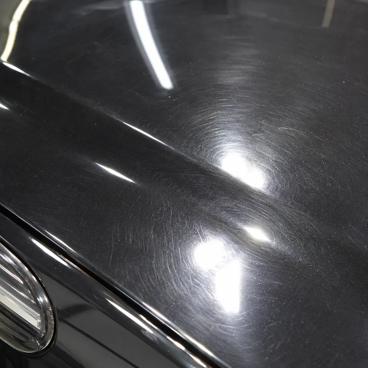 Before paint correction — swirl marks and scratches